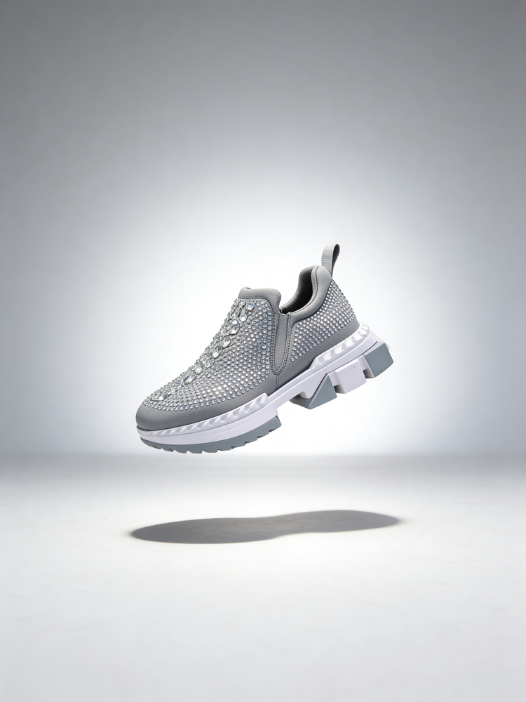 Gray rhinestone womens sneaker on a light gray background