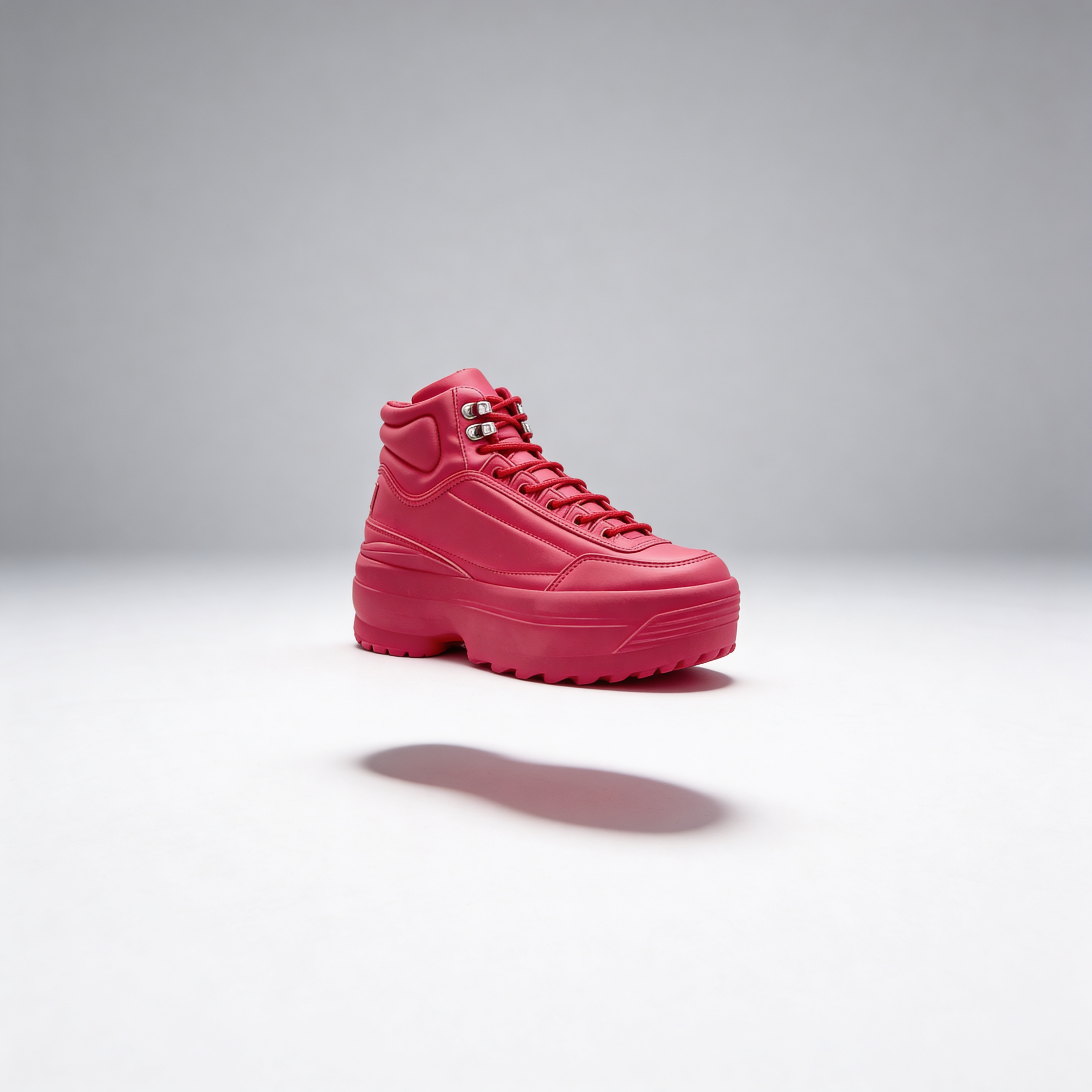 Pink high-top sneaker on a gray background