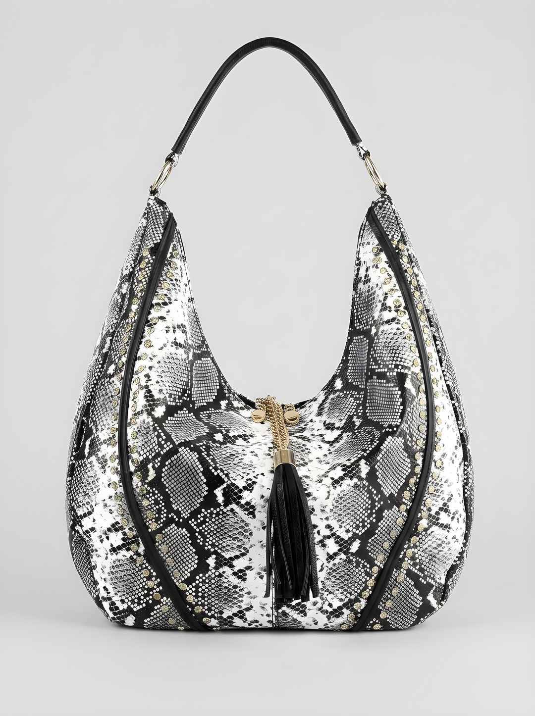 Snakeskin pattern handbag with a tassel on a light gray background