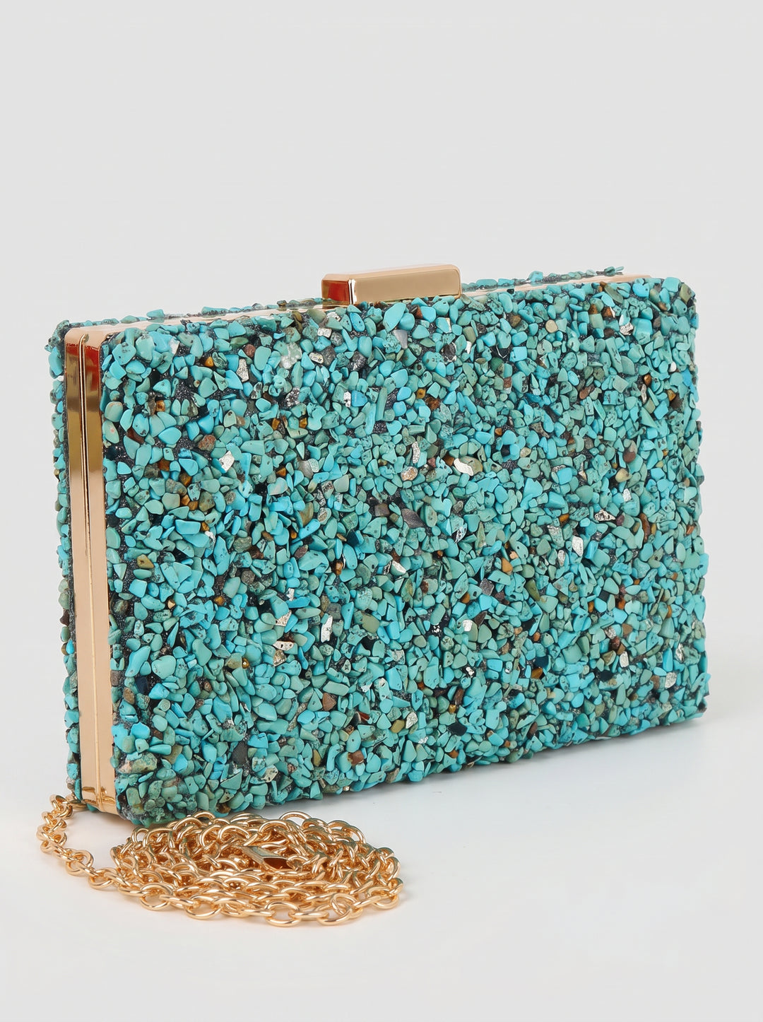 Turquoise textured clutch bag with gold chain on a white background