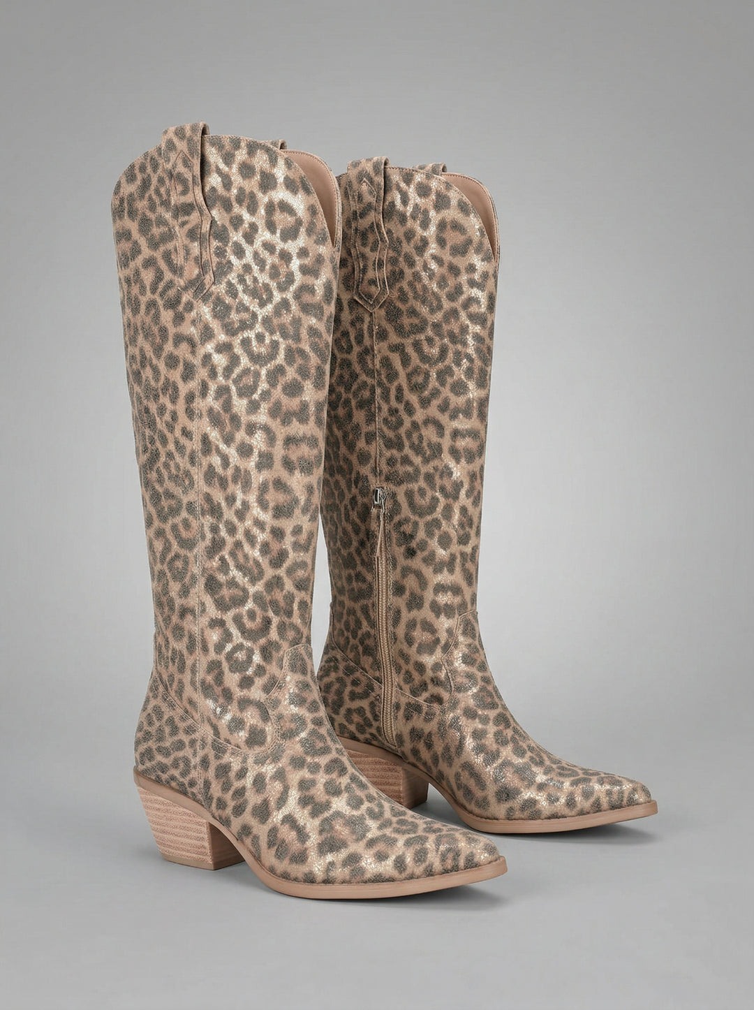 Leopard print knee-high boots on a gray background